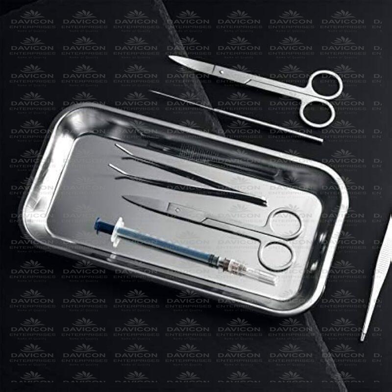 "Premium surgical instruments set including scissors, forceps, clamps, and needle holders on stainless steel tray, representing Davicon Surgical tools"